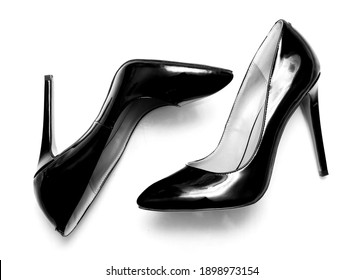 Beautiful Female Shiny Black Stilettos On A White Background