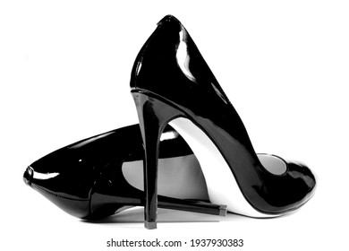 beautiful female shiny black stilettos on a white background