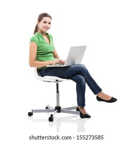 Beautiful female student sitting on a chair with a laptop, isolated over a white background - Shutterstock ID 155273585