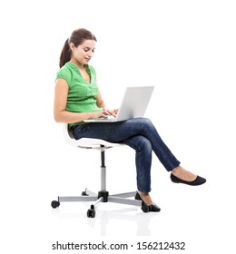 Beautiful female student sitting on a chair with a laptop, isolated over a white background - Shutterstock ID 156212432
