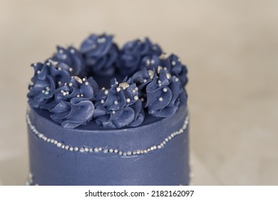 Beautiful Festive Cake Biscuit With Different Creams. Wedding Cake With Flowers. Appetizing Blue Like Ice A Wedding Cake Decorated With Large Roses. Fancy Wedding Cake. Pastry Dessert From Above.