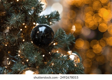 Beautiful festive decorations on the Christmas tree. Close-up. Beautiful Christmas background. The concept of decorations and decor for the new year. New Year's Card 2025 - Powered by Shutterstock