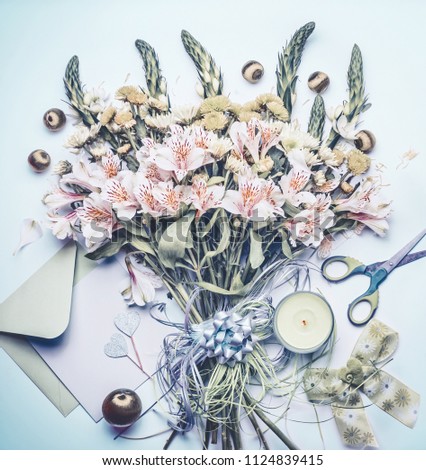 Bouquet with greeting card and candle