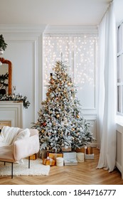 Beautiful Festively Decorated Room With A Christmas Tree. Cozy Bright Living Room With Stylish Modern Decor.