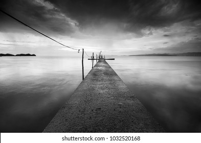 Beautiful fine art image in black & white of abandon jetty at Pulau Pinang, Malaysia. Soft Focus due to long exposure. - Powered by Shutterstock