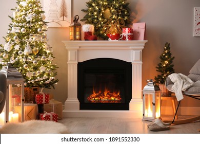 Beautiful fireplace, Christmas tree and other decorations in living room. Interior design - Powered by Shutterstock