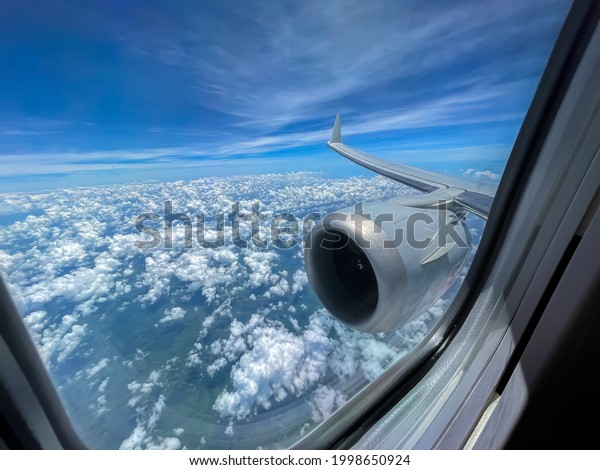 Beautiful first\
person view of a plane\
window