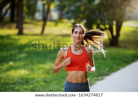 Similar – Image, Stock Photo Happy woman jogging with her smartphone