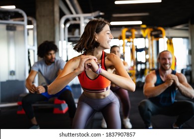 Beautiful Fit People Working Out In Gym Together