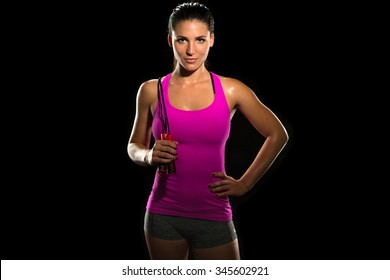 Beautiful Fit Thin Slim Toned Female Body Jump Rope Athlete Isolated On Black Standing Confidently