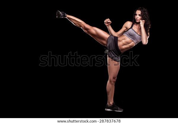 beautiful fit woman in combat position