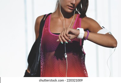 Beautiful Fitness Woman Looing Ath Her Watch, Outdoor Shot