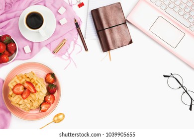 Beautiful Flatlay Arrangement With Cup Of Coffee, Hot Waffles With Cream And Strawberries, Laptop And Other Business Accessories: Concept Of Busy Morning Breakfast, White Background.