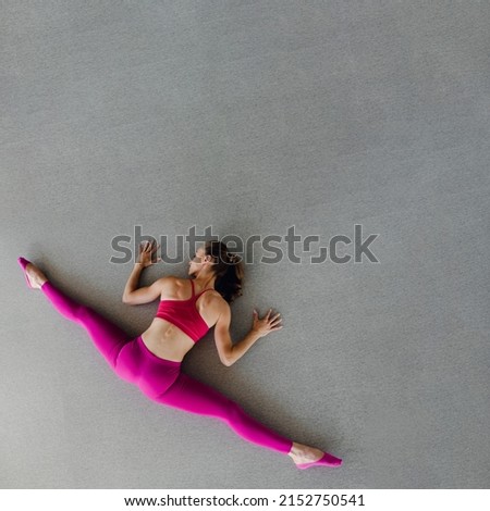 Similar – Woman doing a handstand on the beach