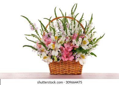 Beautiful Floral Arrangement In Basket Isolated On White