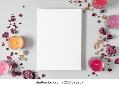 Beautiful floral composition with roses and candles. Blank linen canvas for creativity with dry roses and candles on a gray table background. Top view - Powered by Shutterstock