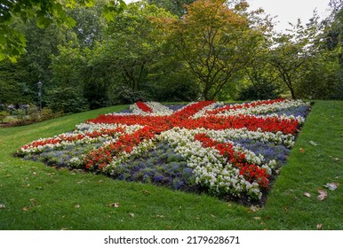 A Beautiful Flower Display In Style Of The Union Jack Flag In English City Gardens. UK Flag Design Made From Planted Flowers. City Park Flower Display