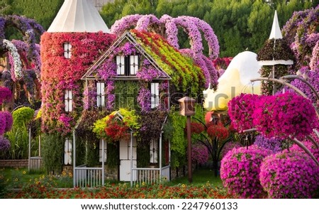Beautiful flower garden or park with many flowers and decorations