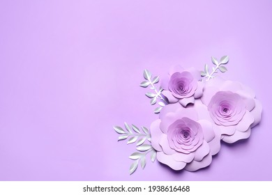 Beautiful flowers and branches made of paper on violet background, flat lay. Space for text