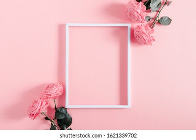 Beautiful flowers composition. Blank frame for text, pink rose flowers on pastel pink background. Valentines Day, Easter, Birthday, Happy Women's Day, Mother's day. Flat lay, top view, copy space - Powered by Shutterstock