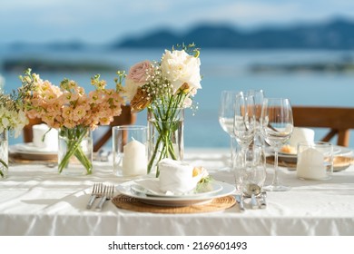 Beautiful flowers decorated on the table.Tables set for an event party or wedding reception. luxury elegant table setting dinner in a restaurant. glasses and dishes. Fancy moment fancy time. - Shutterstock ID 2169601493