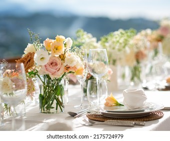 Beautiful flowers decorated on the table.Tables set for an event party or wedding reception. luxury elegant table setting dinner in a restaurant. glasses and dishes. Fancy moment fancy time. - Shutterstock ID 2175724979