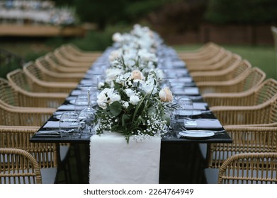 Beautiful flowers decorated on the table.Tables set for an event party or wedding reception. luxury elegant table setting dinner in a restaurant. glasses and dishes.  - Powered by Shutterstock
