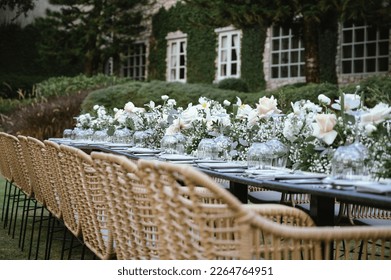 Beautiful flowers decorated on the table.Tables set for an event party or wedding reception. luxury elegant table setting dinner in a restaurant. glasses and dishes.  - Powered by Shutterstock