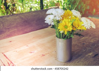 beautiful flowers in  recycled can, vintage style - Powered by Shutterstock