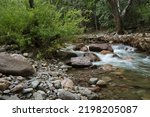 Beautiful flowing creek water is natual tranquility in Chiricahua Mountains of Cave Creek Canyon in Portal, Arizona, USA