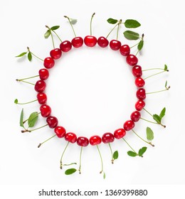 Beautiful Food Circle Frame Of Red Ripe Cherries. Arrangement Of Fresh Cherry With Green Leaves Isolated On White Background. Top View. Flat Lay.