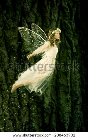 Beautiful forest fairy in flight