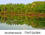 Beautiful forest scenery reflects off a lake at Kettle Moraine State Forest in Wisconsin