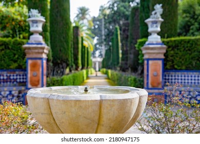 Beautiful Formal Public Garden Inside Alcazar Seville Palace In Summertime In Andalusia