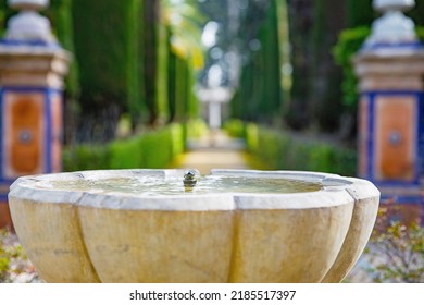 Beautiful Formal Public Garden Inside Alcazar Seville Palace In Summertime In Andalusia