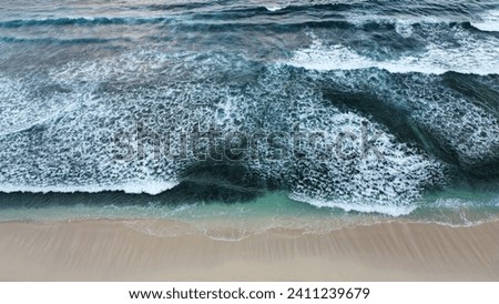 Similar – Aerial Drone View Of Blue Ocean Waves And Beautiful Sandy Beach Shore in Portugal