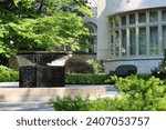 A beautiful fountain at the entrance of a magnificent house