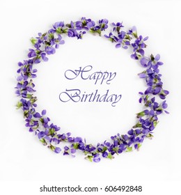 Beautiful Fragile Spring Violets On A White Background Close Up. Happy Birtday Card