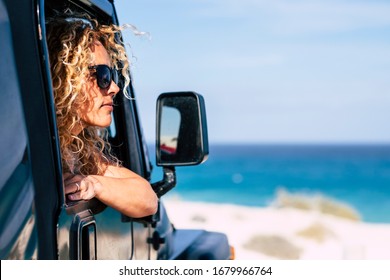 Beautiful Free Caucasian Woman Middle Age Enjoy The View Outside The Window Off The Car - Concept Of Travel And Live Outdoor With Adventure And Vacation With Vehicle - Wanderlust Lifestyle People