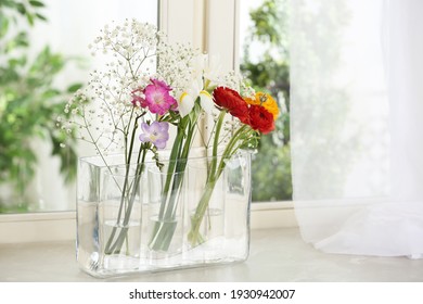 Beautiful Fresh Flowers On Window Sill Indoors