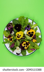 beautiful fresh salad with edible flowers - Shutterstock ID 2090115388