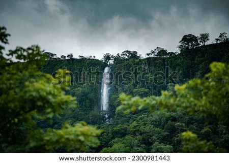 Beautiful fresh vegetation at Anton Valley in Panama with a waterfall and cloudscape