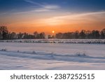 Beautiful  frosty winter sunsest over a small house