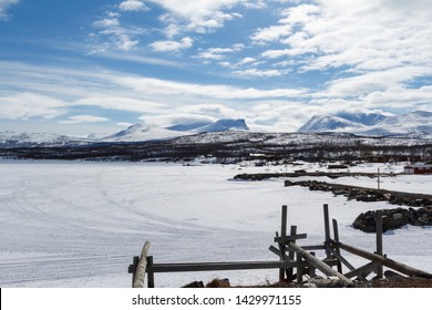 The Beautiful Frozen Torneträsk Lake In The Abisko National Park, Sweden