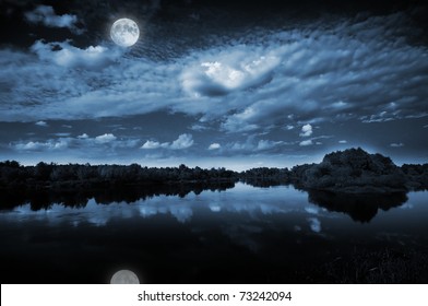 Beautiful Full Moon Reflecting In A Lake