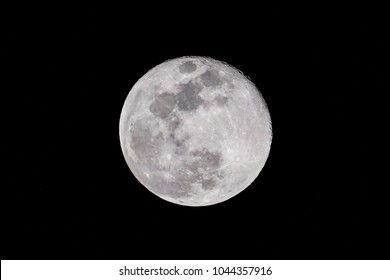 A beautiful full moons glows in the night sky. - Powered by Shutterstock