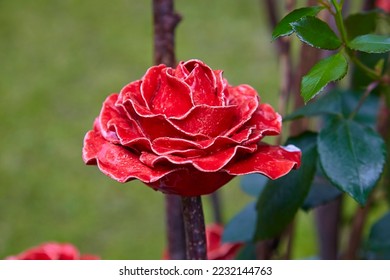 Beautiful garden decoration, a flower replica made of ceramic, (red rose replica). - Shutterstock ID 2232144763