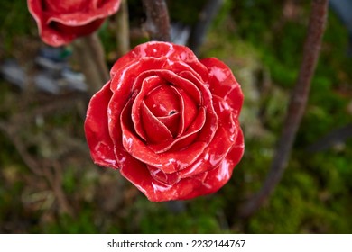 Beautiful garden decoration, a flower replica made of ceramic, (red rose replica). - Shutterstock ID 2232144767
