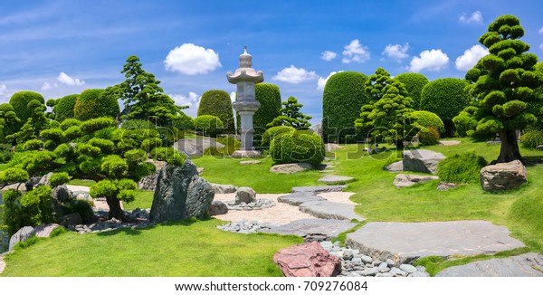 Beautiful garden in the eco\
tourism is designed in harmony with many cypress, pine, stone and\
ancient trees bearing the traditional culture of traditional\
Japanese gardens.