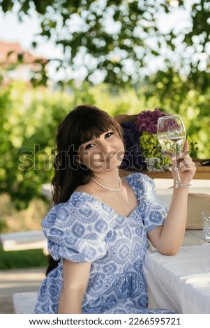 Similar – Young woman with closed eyes laughing over nature background